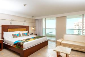 Postel nebo postele na pokoji v ubytování Hotel Dann Cartagena