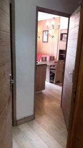 an open door to a kitchen with a counter top at T2 RESIDENCE ANTARES 4* pieds des pistes in Risoul