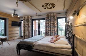 En eller flere senge i et værelse på Willa Aspen