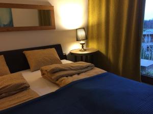 Posteľ alebo postele v izbe v ubytovaní Apartamenty Miły - Gdynia Redłowo