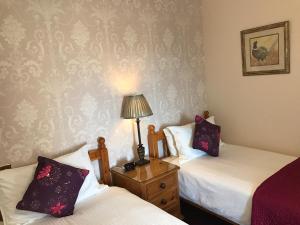 Postel nebo postele na pokoji v ubytování RossMor Bed & Breakfast