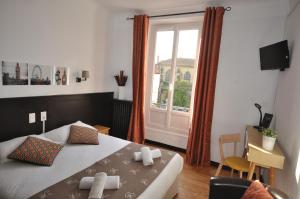 Un ou plusieurs lits dans un hébergement de l'établissement Hotel Cote Basque