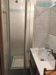a bathroom with a shower and a sink and a tub at Villa Cemaste in Montpellier