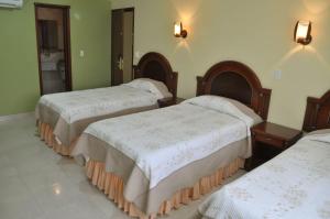 Postel nebo postele na pokoji v ubytování Hotel el Caimito + 37 fotografií