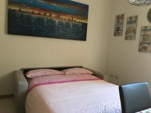 A bed or beds in a room at La Casa di San Francesco