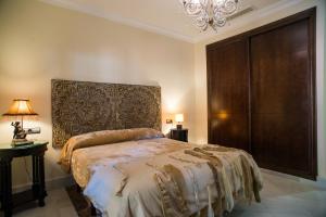 Łóżko lub łóżka w pokoju w obiekcie Hotel Coral Playa
