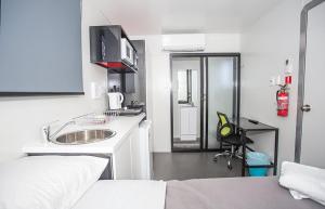 Kuchyň nebo kuchyňský kout v ubytování Mycow Accommodation Mackay