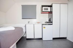 Kuchyň nebo kuchyňský kout v ubytování Mycow Accommodation Mackay