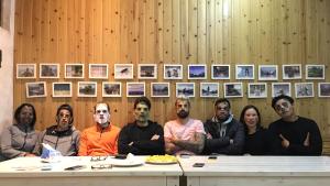 a group of people sitting at a table at Zen Box House in Yangshuo