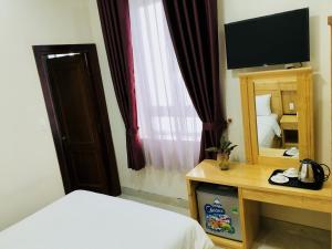 Postel nebo postele na pokoji v ubytování Starhill Hotel