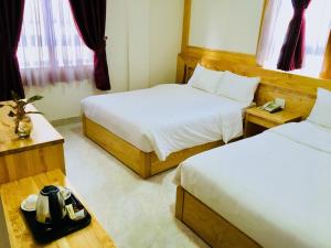 Postel nebo postele na pokoji v ubytování Starhill Hotel