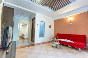 TV a/nebo společenská místnost v ubytování PorterHouse Beach Hotel