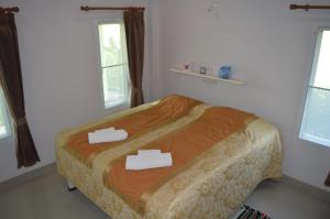 Postel nebo postele na pokoji v ubytování Ban Khan LeeMa