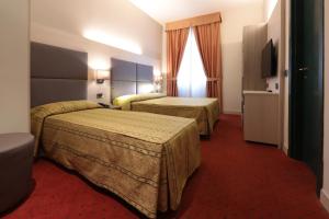Posteľ alebo postele v izbe v ubytovaní Hotel Campion CityLife