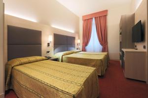 Posteľ alebo postele v izbe v ubytovaní Hotel Campion CityLife