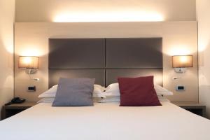 Posteľ alebo postele v izbe v ubytovaní Hotel Campion CityLife
