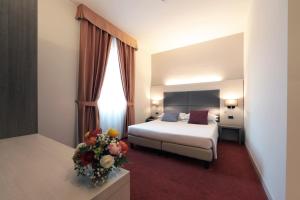 Posteľ alebo postele v izbe v ubytovaní Hotel Campion CityLife