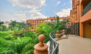 a balcony of a hotel with a building in the background at Kampala Serena Hotel in Kampala
