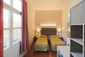 Posteľ alebo postele v izbe v ubytovaní Hotel Campion CityLife
