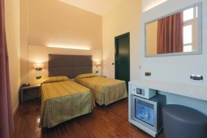 Posteľ alebo postele v izbe v ubytovaní Hotel Campion CityLife