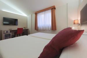 Posteľ alebo postele v izbe v ubytovaní Hotel Campion CityLife