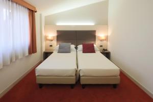 Posteľ alebo postele v izbe v ubytovaní Hotel Campion CityLife