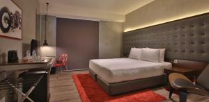 Letto o letti in una camera di The B Hotel Quezon City