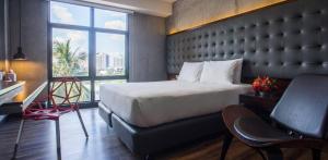 Letto o letti in una camera di The B Hotel Quezon City