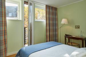 Postel nebo postele na pokoji v ubytování hotel brasserie au violon