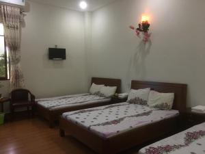 Postel nebo postele na pokoji v ubytování Anh Duong Hotel