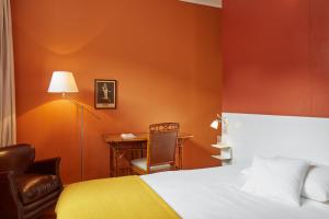 Postel nebo postele na pokoji v ubytování hotel brasserie au violon