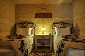 Postel nebo postele na pokoji v ubytování 4 Oda Cave House - Special Class