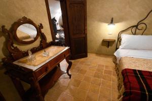 Postel nebo postele na pokoji v ubytování Robur Marsorum Albergo Diffuso