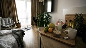 a living room with a table with fruit on it at The Mint Villa - Saint Vlas in Sveti Vlas