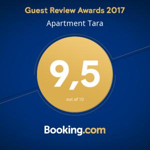 a sign that reads quest review awards participant taza at Apartment Tara in Sumartin