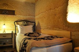 Postel nebo postele na pokoji v ubytování 4 Oda Cave House - Special Class