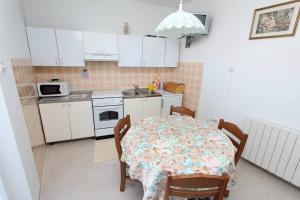 Kuchyň nebo kuchyňský kout v ubytování Apartments Milka + 12 fotografií