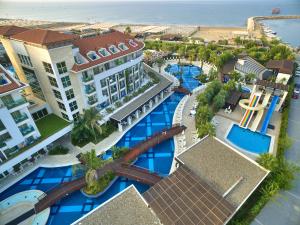 an overhead view of a resort with blue pools at Sunis Evren Beach Resort Hotel & Spa in Side