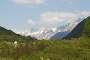 a view of a mountain range with snow capped mountains at Casetta Villa in Villa di Chiavenna
