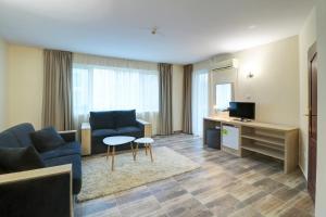 TV a/nebo společenská místnost v ubytování Family Hotel Jupiter
