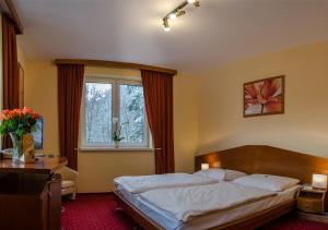 Posteľ alebo postele v izbe v ubytovaní Hotel West