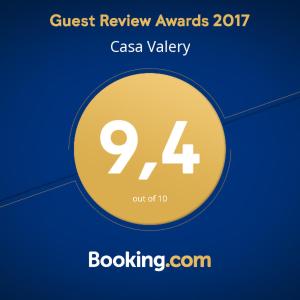 a sign that says guest review awards caa valley at Casa Valery Wonderful Sea View in Porto Rotondo