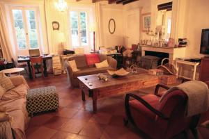 a living room with a couch and a table at les mondains in Margueron