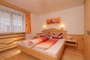 Ένα ή περισσότερα κρεβάτια σε δωμάτιο στο Gästehaus Renate
