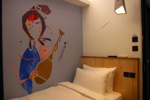 Postel nebo postele na pokoji v ubytování Just Inn Xin Yi 正旅館 信義