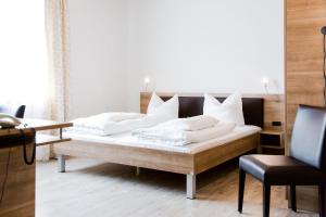 Postel nebo postele na pokoji v ubytování Hotel Palko