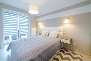 Posteľ alebo postele v izbe v ubytovaní DP Apartament Polanki Park + 19 fotografií