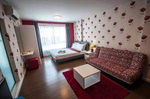 a living room with a bed and a couch at Baan Imm Aim Condo Hua Hin in Hua Hin +26 photos
