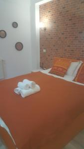 Кровать или кровати в номере Pensiune Spital Fundeni