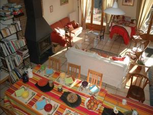 a living room with a couch and a fireplace at Chalet l'Angélique in Bolquere Pyrenees 2000